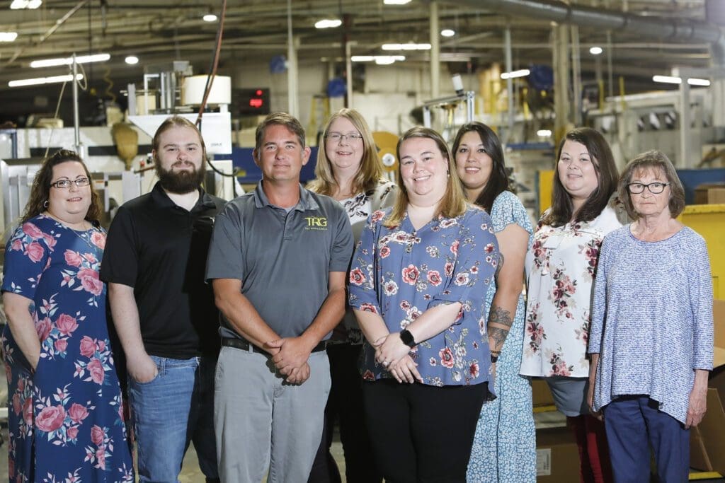 Skye Stephens (Bottom row-far right)  Customer Service Representative Josh Hartman (Bottom row-second from right)  Customer Service Manager Teresa Gilliland (Top row-far Right)  Accounting Clerk Crystal Dutton (Top row-second from right)  Production Resource Coordinator Kayla Carmack (Top row-third from right)  Customer Service Representative Angie Riley (Top row-fourth from right)  Customer Service Representative Chase Wood (Top row-fifth from right)  Structural Designer Andrea Younger (Top row-sixth from right)  Customer Service Representative